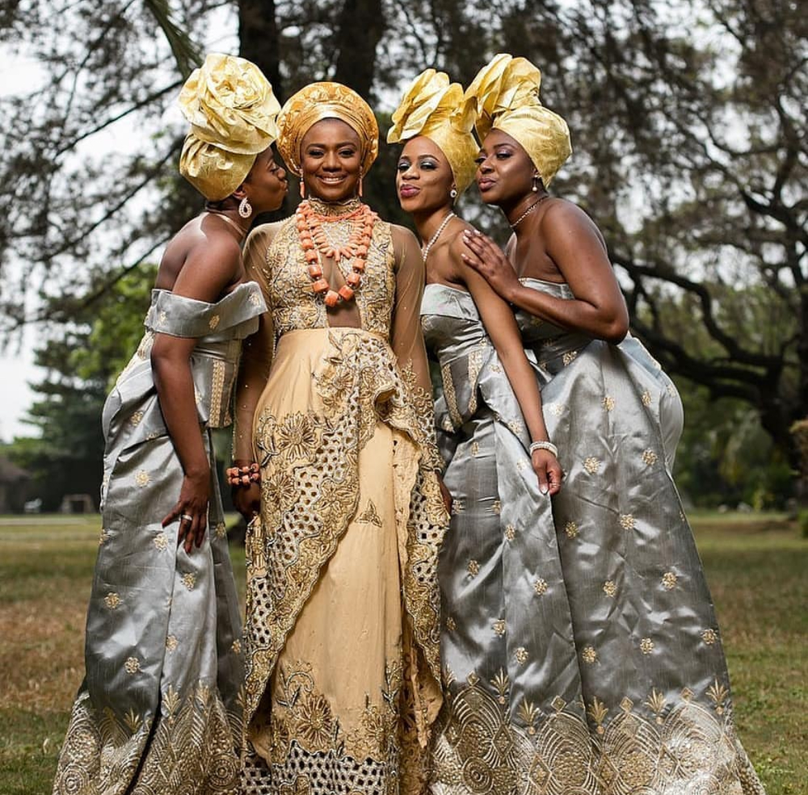 Bridal party in gold gele and silver aso-ebi