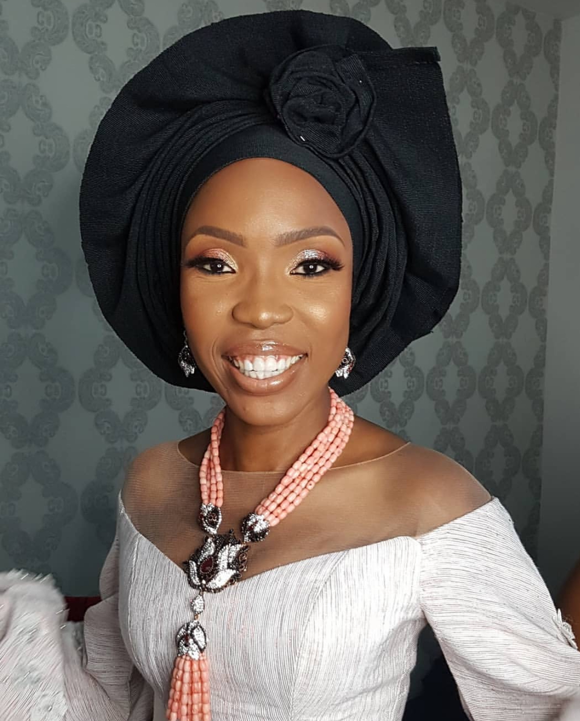 Classic black gele with rose fold